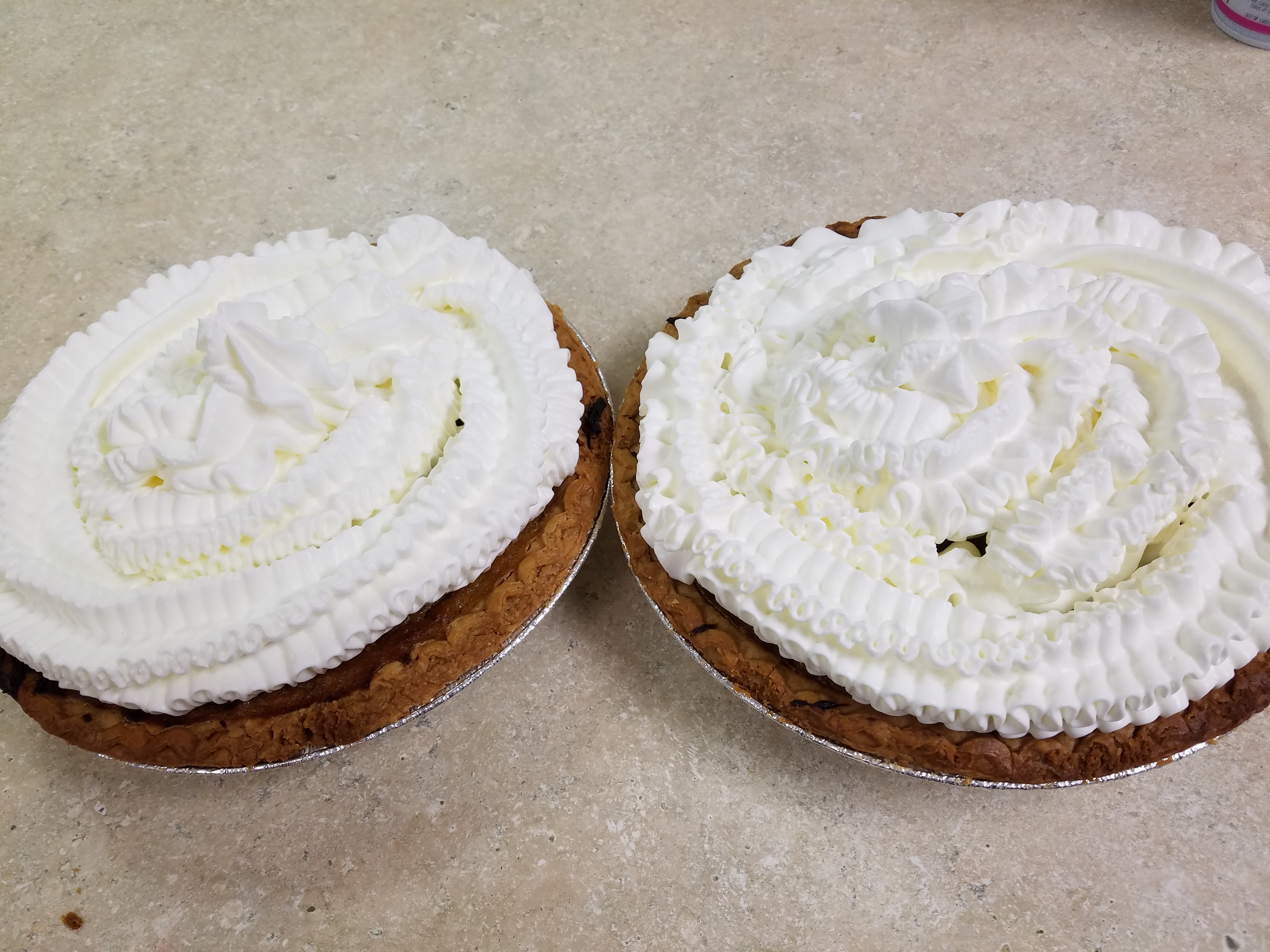2 pies with whipped cream