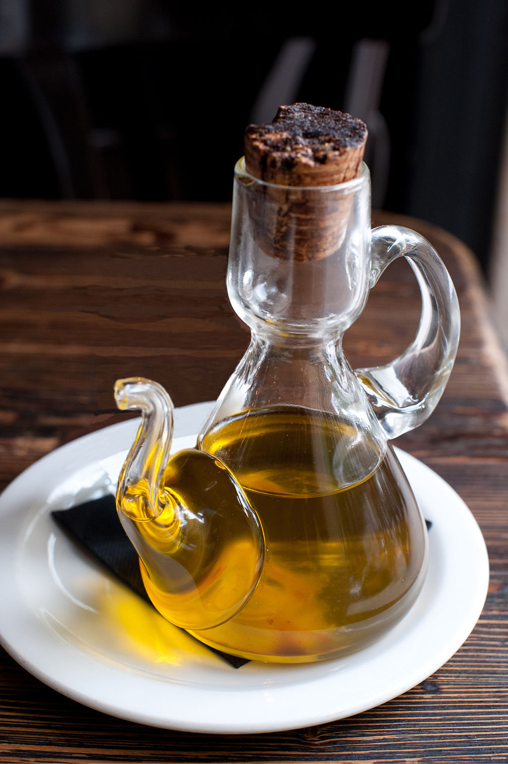 delicate glass jar of olive oil