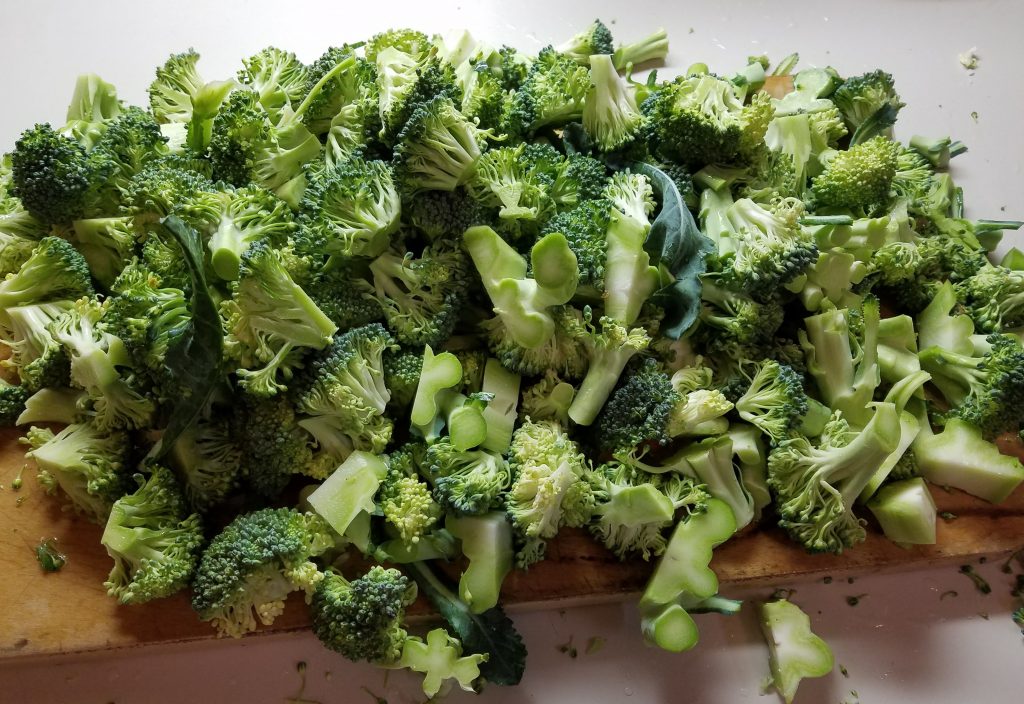 chopped broccoli on a cutting board