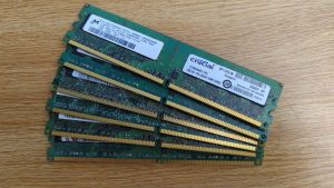 A collection of computer parts, six sticks of RAM