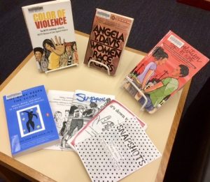 A photo of books displayed on a table for sexual assault activism month