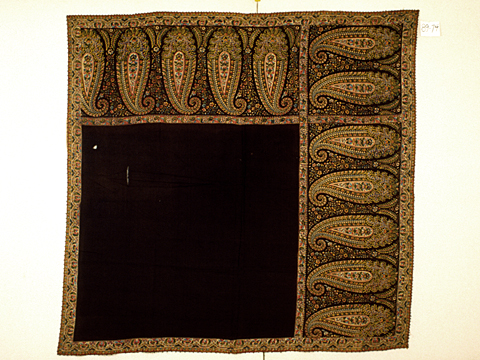 Maker: Unknown Culture: French (possibly) Title: Shawl Date Made: 1820-1840 Type: Clothing Materials: Textile: black twill weave wool or silk (warp) and wool (weft); polychrome block printed design Place Made: France (possibly) Measurements: Overall: 55 in x 57 in; 139.7 cm x 144.78 cm Credit Line: Gift of Mr. and Mrs. Parker Hubbard Accession Number: 89.074 Collection: Historic Deerfield