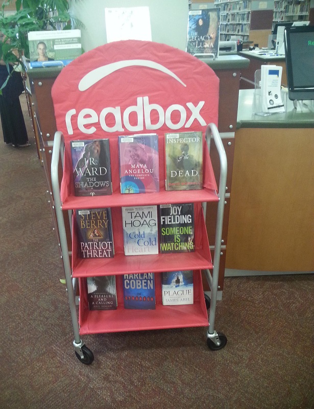 Parody of DVD rental system Redbox at library called Readbox and offering books.