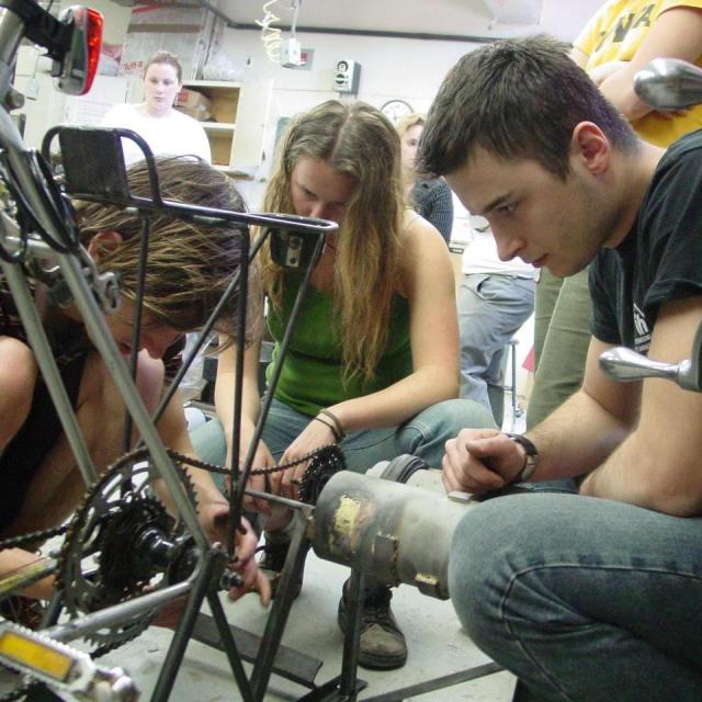 Students examining pedal powered blender.