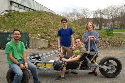 Students with electric vehicle project