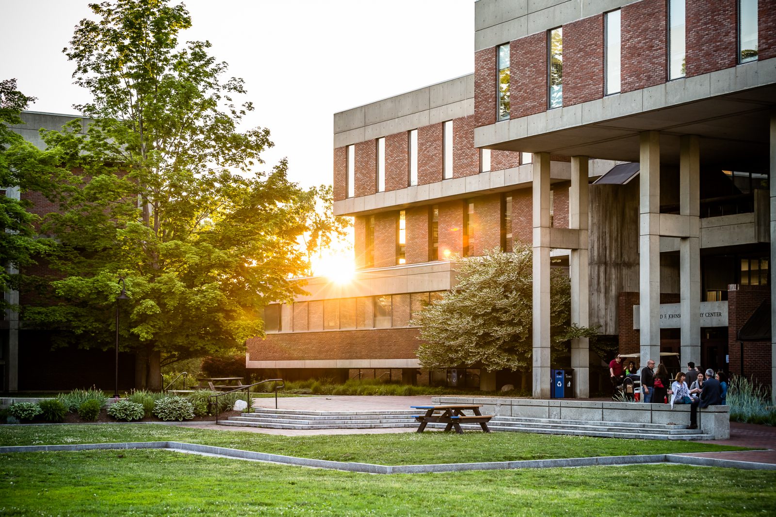 A front view of the library with the sun setting in the background