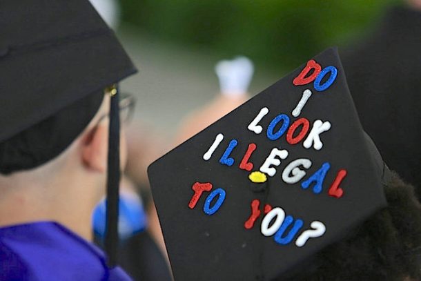 Student's graduation cap reads, "do I look illegal to you?"