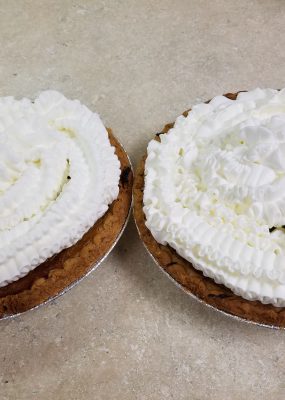2 butternut squash pies with whipped cream