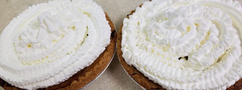 2 butternut squash pies with whipped cream
