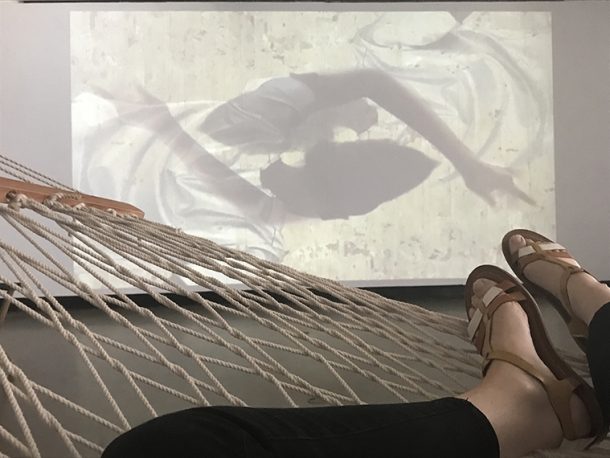 Video installation, feet on hammock
