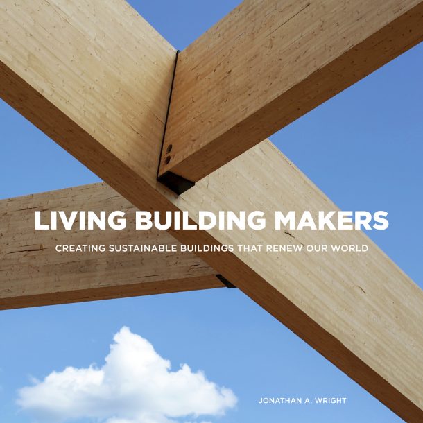 A photo of three tan wood planks connected together leaving differen shaped triangles in the open space that shows the blue sky and one white cloud. The photo is captioned, "Living Building Markers. Creating sustainable buildings that renew our world." The name, "Jonathan A. Wright," on the bottom right corner.