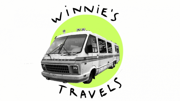 A green circle with a black and white photo of a travel bus. Two words bend around the green circle saying, "Winnie's Travels."
