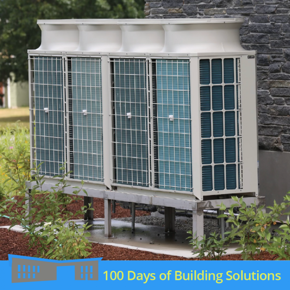 Two air source heat pump units sit outside the R.W. Kern Center's grey stone exterior. A banner at the bottom of the image includes a simple shape of the R.W. Kern Center and reads: 100 Days of Building Solutions.
