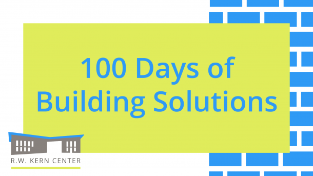 White background with a blue brick wall pattern on the right side. A yellow-green rectangle on top of the white and the blue brick wall. In the rectangle words in blue reads, "100 Days of Building Solutions." The R.W. Kern Center logo on the lower left corner.