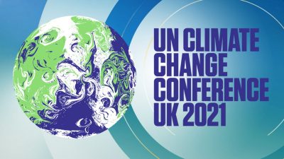 A multi-color (different shades of blue and white) digital image with "U.N. Climate Change Conference U.K. 2021," withe the Earth next to it.