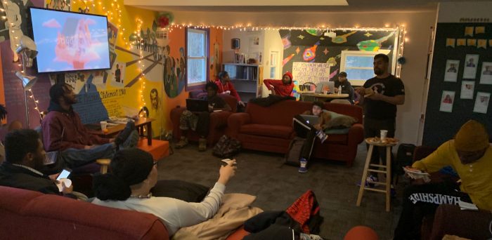 Students doing homework and watching television in the Cultural Center