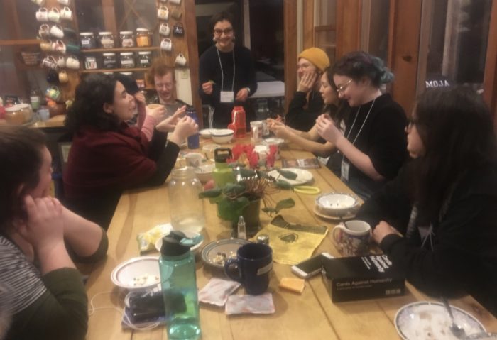 students sitting at a table eating
