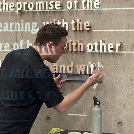 Gallery Director working on installation